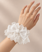 Real hand wearing white Christmas Bridal Lolita wrist cuff