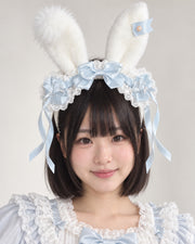 Light blue striped plush bunny ear Lolita headband worn by Bowlita model