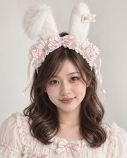 Light pink polka dot plush bunny ear Lolita headband worn by Bowlita model