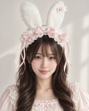 Light pink striped plush bunny ear Lolita headband worn by Bowlita model