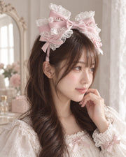 Model in three-quarter view wearing blush pink Christmas Bridal Lolita KC headband