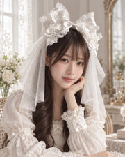 Model wearing white Christmas Bridal Lolita KC headband and white veil